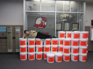 student on top of emergency kits